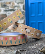 Babipur eco kraft paper tapes with three different Spring design on a wall outdoors. Daffodils, sheep and daisies and pink tulips.