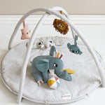 A child happily playing with the Elephant activity toy 