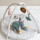 A child happily playing with the Elephant activity toy 