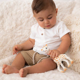  smiling giraffe teether on a cream background