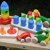 Bajo 10 piece sorting board placed on a Miri slide surrounded by other Bajo wooden toys.