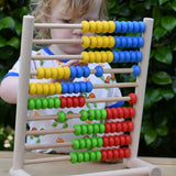 Child playing with the Bajo 100 Bead Abacus counting toy. 