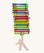 Bajo Athlete wooden stacking and balance game. A wooden toy figure used as a base to stack colourful slim wooden batons.