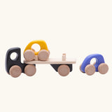 Bajo black auto car transporter vehicle with two cars. Yellow car is placed on the trailer, purple car placed behind the transporter.