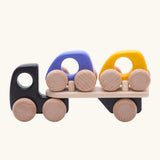 Bajo black auto car transporter vehicle with two cars, purple and yellow. 