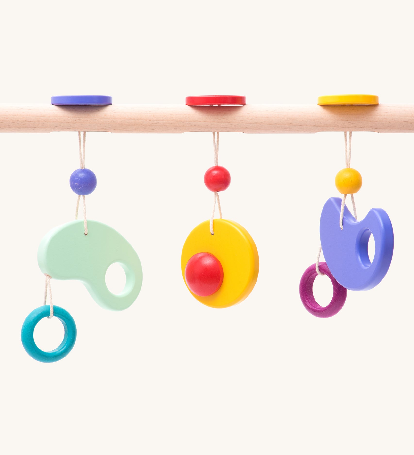 Bajo Wooden Baby Gym with three wooden hanging toys. These heirloom quality toys by Bajo are part of a wide range of wooden toys available here at Babipur. 