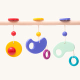 Bajo Wooden Baby Gym with three wooden hanging toys. These heirloom quality toys by Bajo are part of a wide range of wooden toys available here at Babipur. 