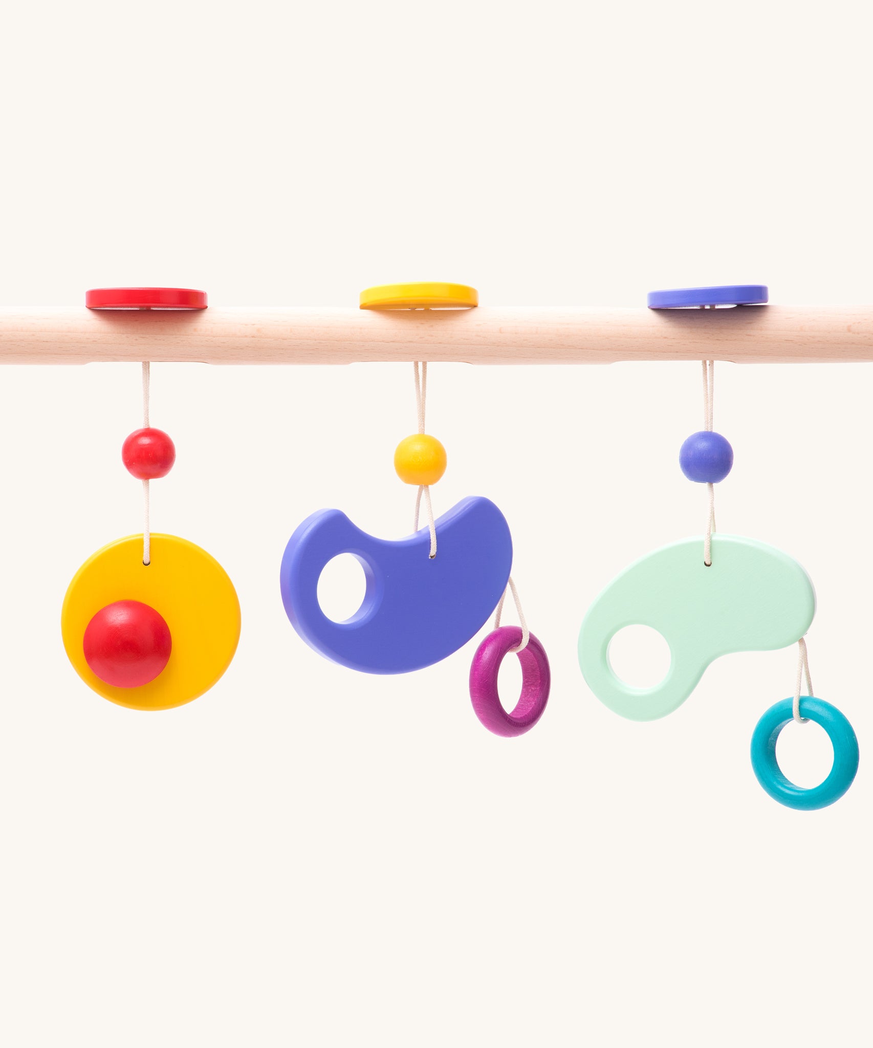 Bajo Wooden Baby Gym with three wooden hanging toys. These heirloom quality toys by Bajo are part of a wide range of wooden toys available here at Babipur. 