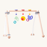 Bajo Wooden Baby Gym with three wooden hanging toys. These heirloom quality toys by Bajo are part of a wide range of wooden toys available here at Babipur. 