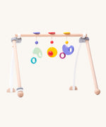 Bajo Wooden Baby Gym with three wooden hanging toys. These heirloom quality toys by Bajo are part of a wide range of wooden toys available here at Babipur. 
