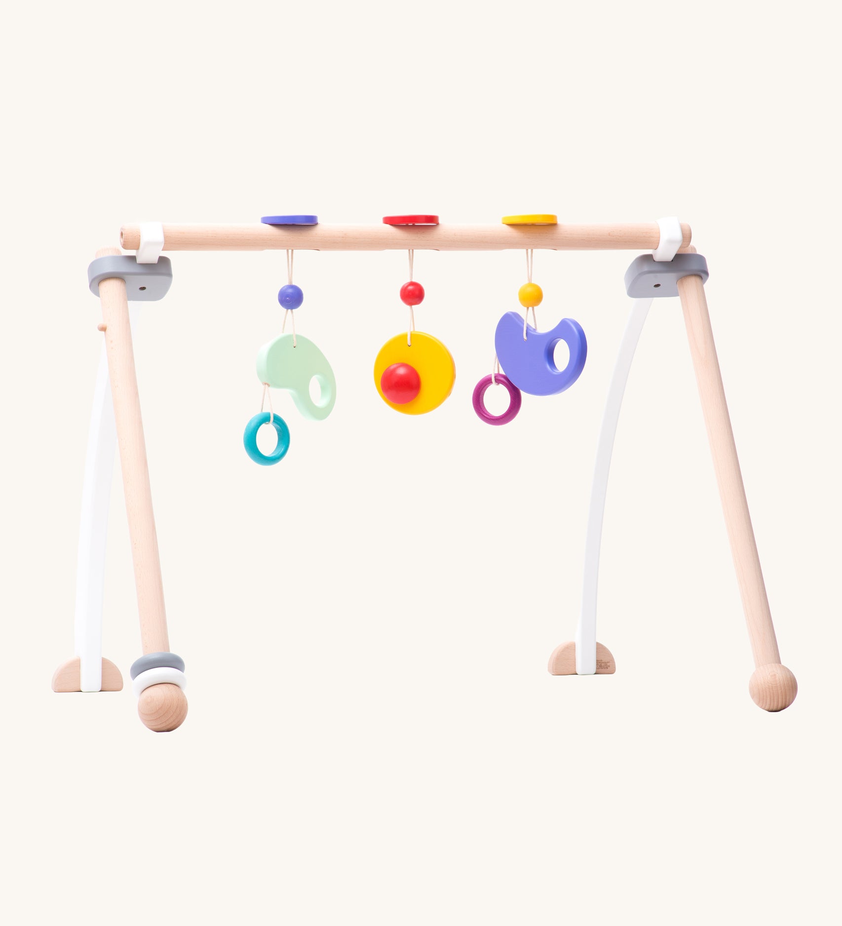 Bajo Wooden Baby Gym with three wooden hanging toys. These heirloom quality toys by Bajo are part of a wide range of wooden toys available here at Babipur. 
