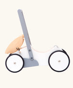 Side profile view of the Bajo wooden monochrome baby walker set up as a dolls pram. The movable hood can also be taken off or placed on the base of the walker.  