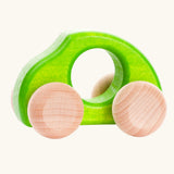 Bajo Beetle toy car in Green, a bright lime green wooden push-along toy for toddlers with a circular hand hole and natural wood wheels, available online from Babipur.
