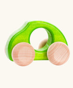 Bajo Beetle toy car in Green, a bright lime green wooden push-along toy for toddlers with a circular hand hole and natural wood wheels, available online from Babipur.