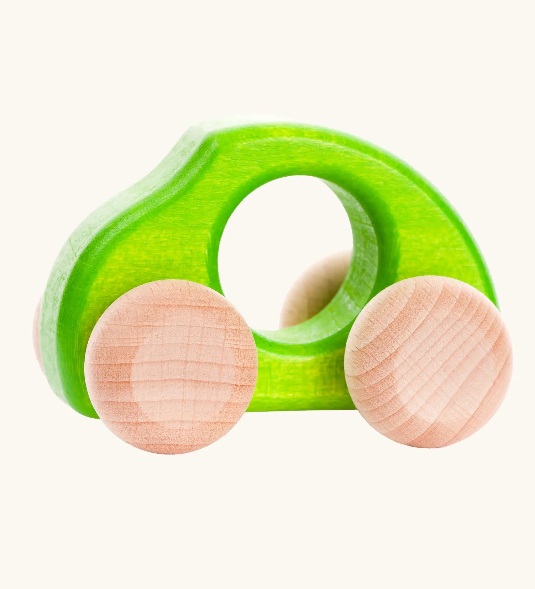 Bajo Beetle toy car in Green, a bright lime green wooden push-along toy for toddlers with a circular hand hole and natural wood wheels, available online from Babipur.