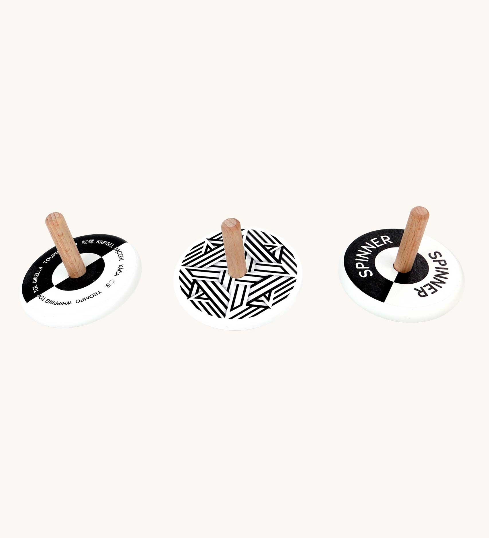 Bajo black and white Spinning Tops. Wooden spinning tops with Black and white monochrome designs with natural wooden sticks.