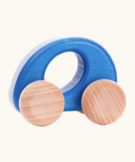 Bajo handmade wooden ellipse car in blue with a oval cut out in the center for grip and unpainted wheels