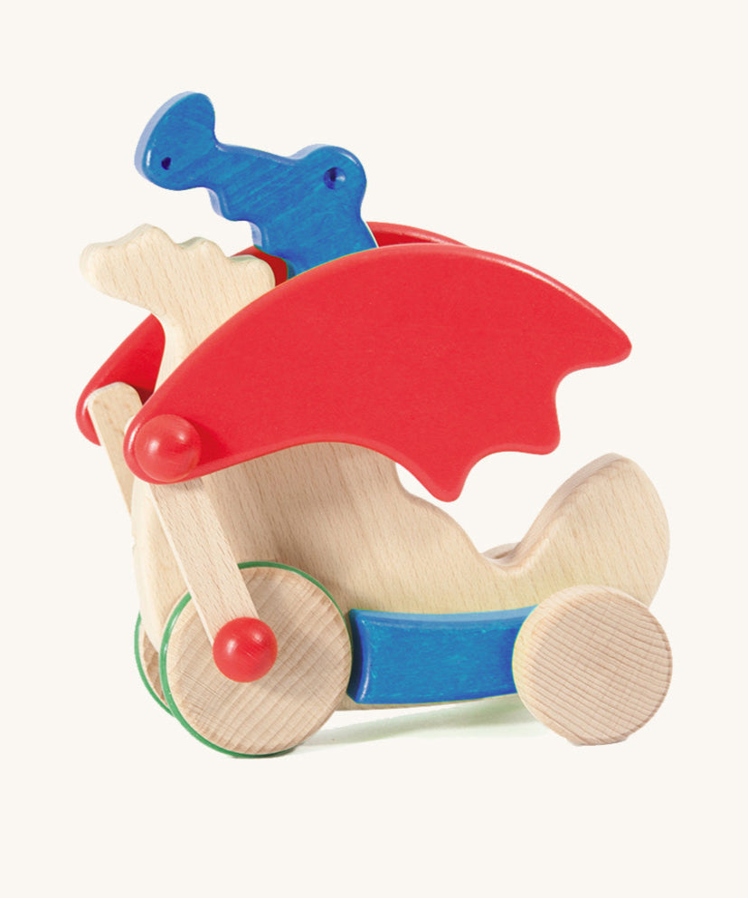 Bajo blue pull along dragon wooden toy available at Babipur. Features two wheels at the front and back and red wing that move along with the front wheels