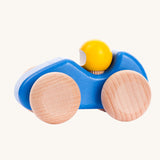 A blue coloured Bajo wooden racing car, the car has natural wooden wheels. This car is part of a wide range of Bajo wooden toy vehicles available at Babipur.