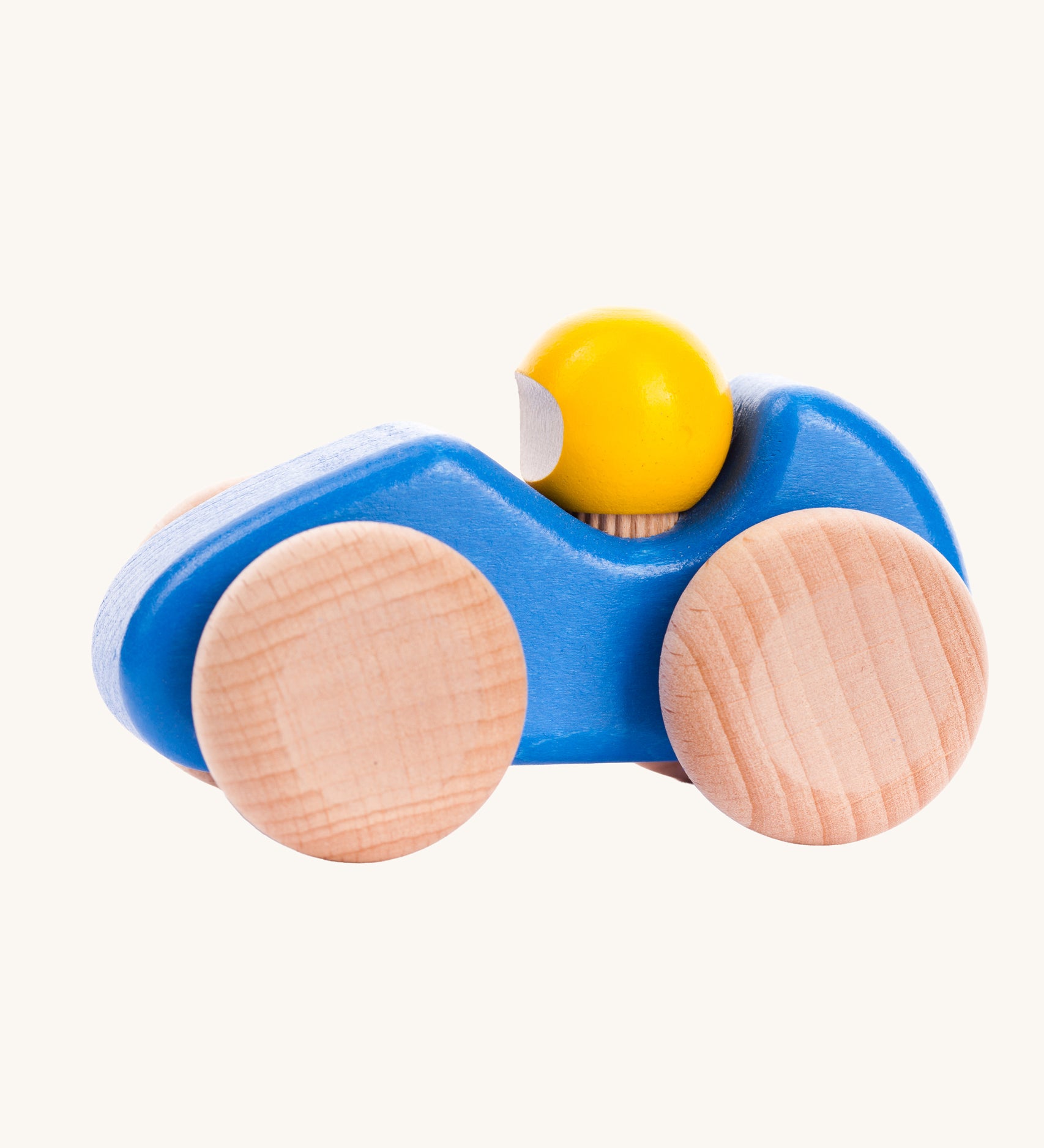 A blue coloured Bajo wooden racing car, the car has natural wooden wheels. This car is part of a wide range of Bajo wooden toy vehicles available at Babipur.