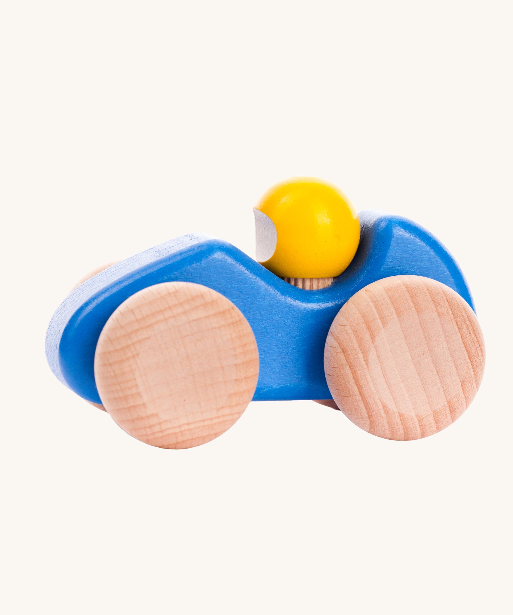 A blue coloured Bajo wooden racing car, the car has natural wooden wheels. This car is part of a wide range of Bajo wooden toy vehicles available at Babipur.