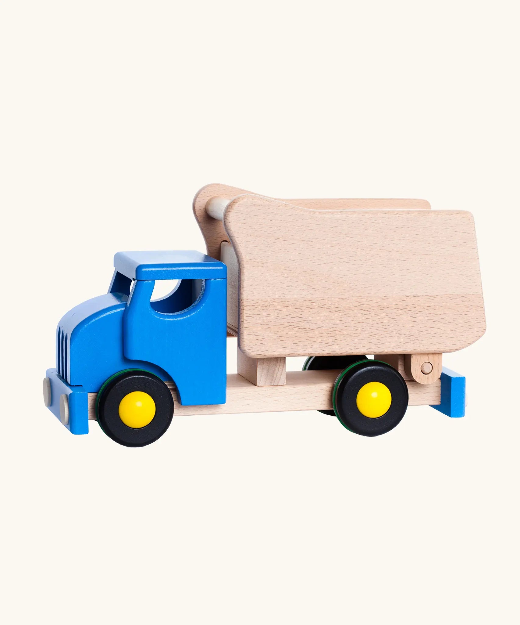 Bajo wooden toy shape sorter dump truck with a blue cab and natural light wood bed, featuring yellow-rimmed wheels.