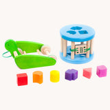 Bajo Blue Snail Sort Roller. A circular shaped wooden shape sorter toy that sits on a pull along snail base. 