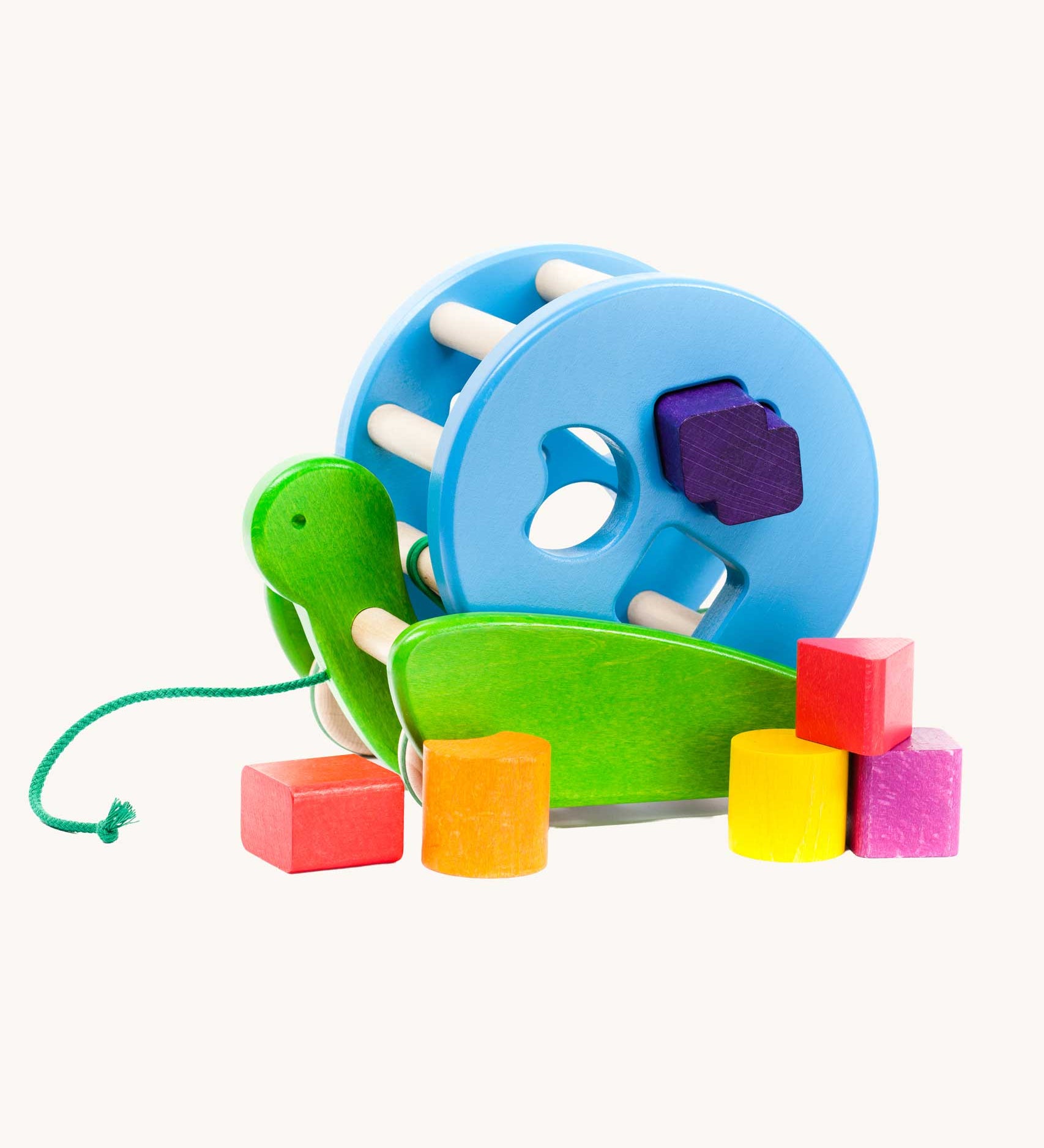 Bajo Blue Snail Sort Roller. A circular shaped wooden shape sorter toy that sits on a pull along snail base. 