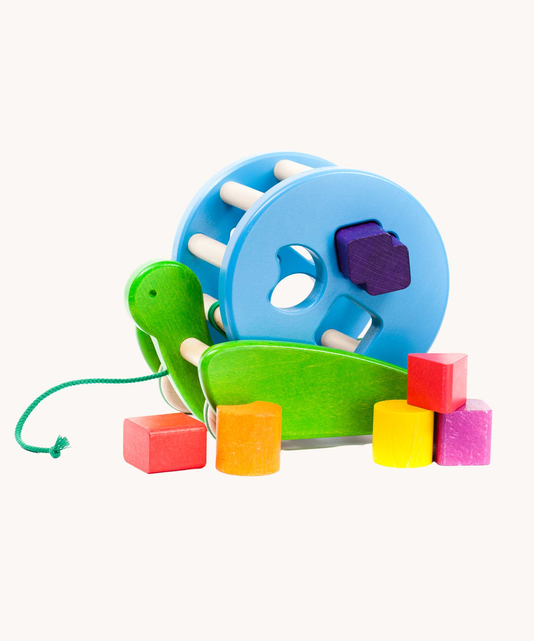 Bajo Blue Snail Sort Roller. A circular shaped wooden shape sorter toy that sits on a pull along snail base. 