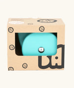 Bajo blue wobbling chicken wooden push along toy shown in it's cardboard packaging box.