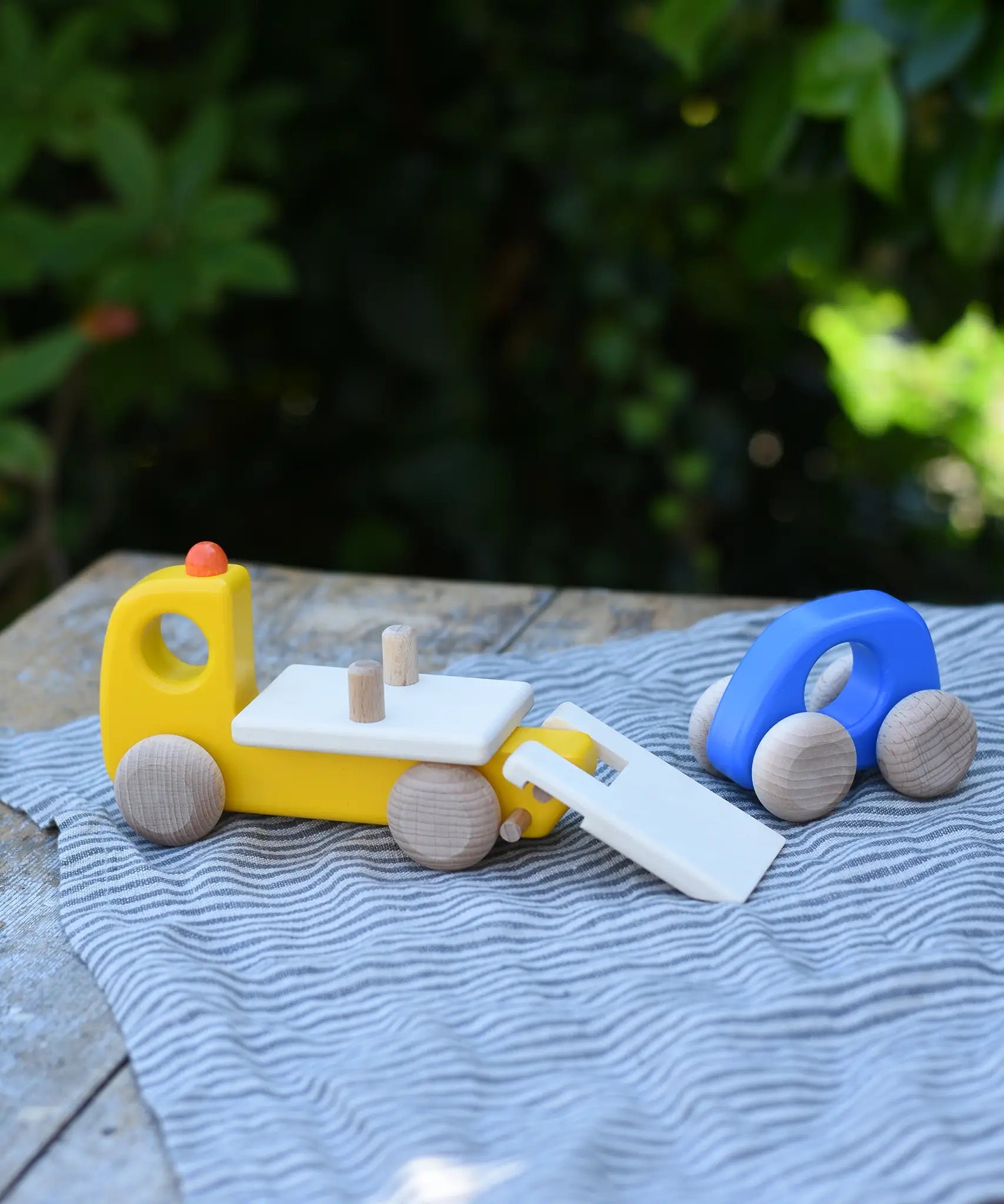 Bajo yellow breakdown lorry wooden toy with a blue coloured car.