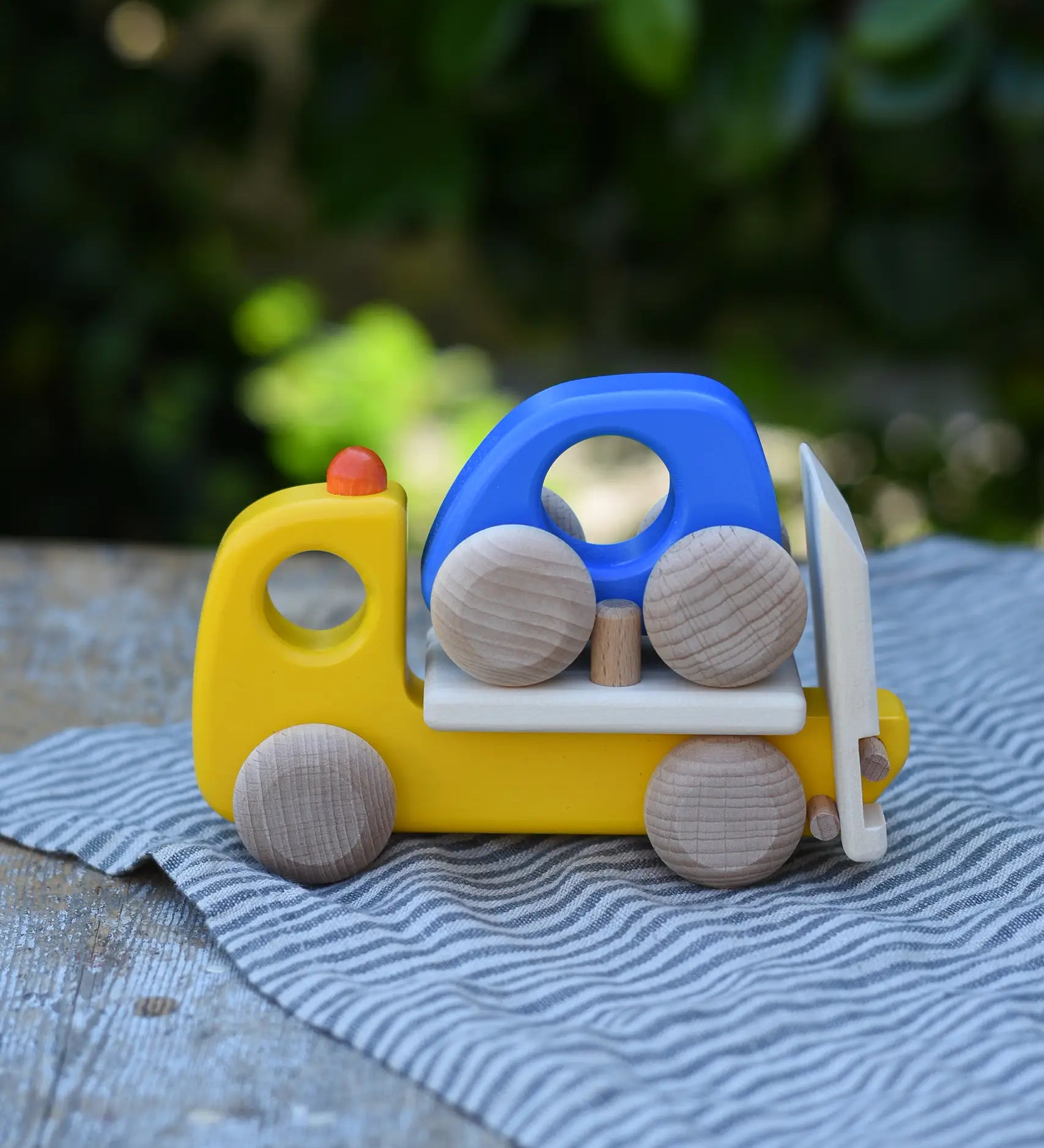 Bajo yellow breakdown lorry wooden toy with a blue coloured car.