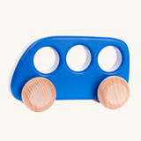 A Bajo blue coloured wooden push along bus toy. This bus is part of a wide range of Bajo wooden toy vehicles available at Babipur.