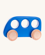 A Bajo blue coloured wooden push along bus toy. This bus is part of a wide range of Bajo wooden toy vehicles available at Babipur.