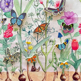 The butterfly shaped pieces from the Bajo World Of Butterflies Sorter Puzzle placed on a Wonderie play cloth. This puzzle has butterfly shaped pieces that are decorated on both sides that slot into the coordinating shapes on the base. These heirloom quality toys by Bajo are part of a wide range of wooden toys available here at Babipur.