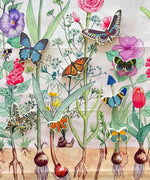 The butterfly shaped pieces from the Bajo World Of Butterflies Sorter Puzzle placed on a Wonderie play cloth. This puzzle has butterfly shaped pieces that are decorated on both sides that slot into the coordinating shapes on the base. These heirloom quality toys by Bajo are part of a wide range of wooden toys available here at Babipur.