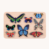 Bajo World Of Butterflies Sorter Puzzle. This puzzle has butterfly shaped pieces that are decorated on both sides that slot into the coordinating shapes on the base. These heirloom quality toys by Bajo are part of a wide range of wooden toys available here at Babipur.