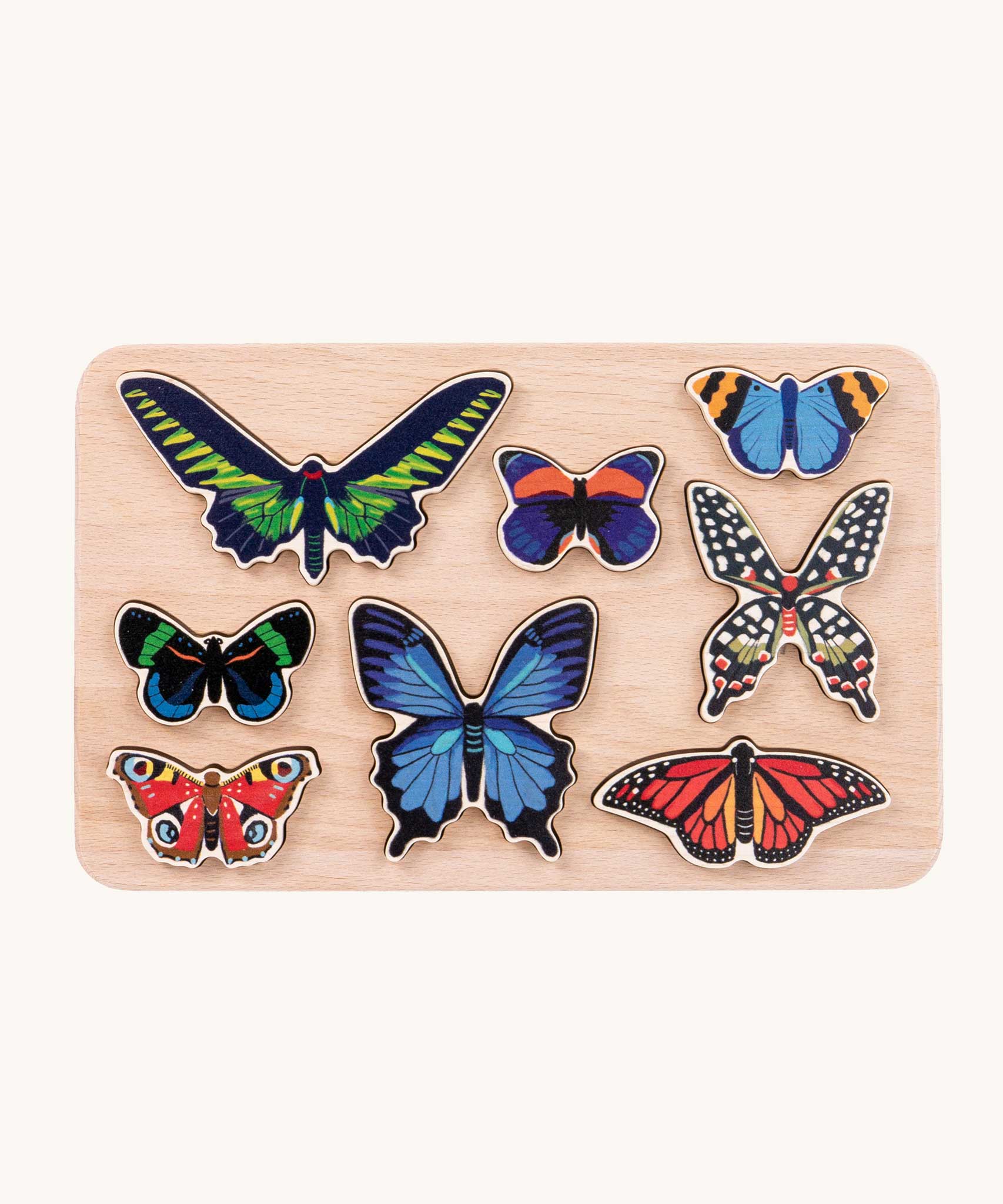 Bajo World Of Butterflies Sorter Puzzle. This puzzle has butterfly shaped pieces that are decorated on both sides that slot into the coordinating shapes on the base. These heirloom quality toys by Bajo are part of a wide range of wooden toys available here at Babipur.