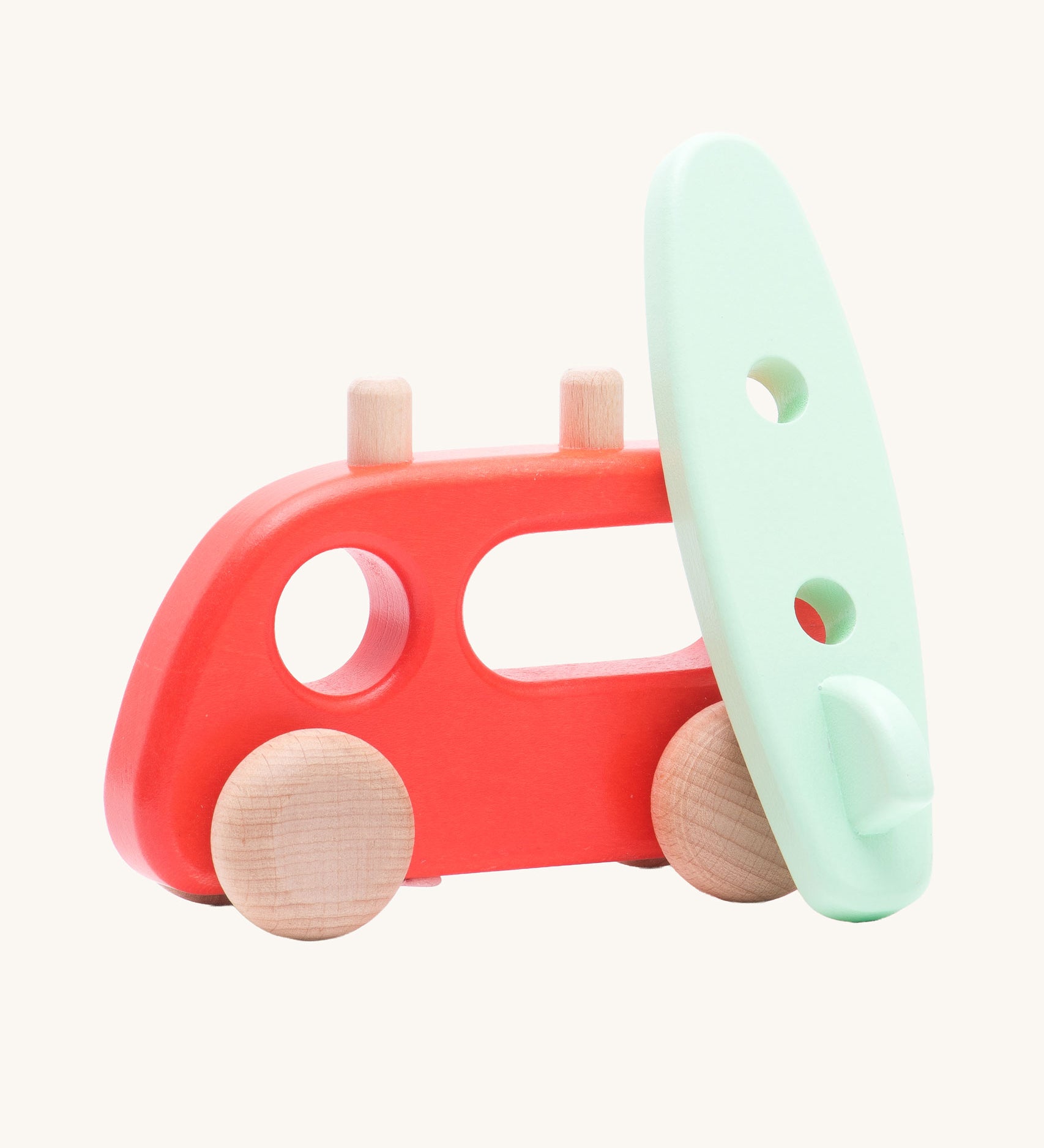 Bajo Camper Van With Surf Board wooden toy vehicle. This red camper van toy comes with a green coloured surf board that sits on the roof. 
These heirloom quality toys by Bajo are part of a wide range of wooden toys available here at Babipur. 