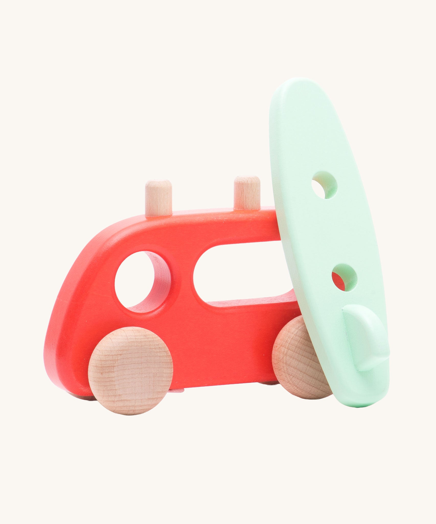 Bajo Camper Van With Surf Board wooden toy vehicle. This red camper van toy comes with a green coloured surf board that sits on the roof. 
These heirloom quality toys by Bajo are part of a wide range of wooden toys available here at Babipur. 