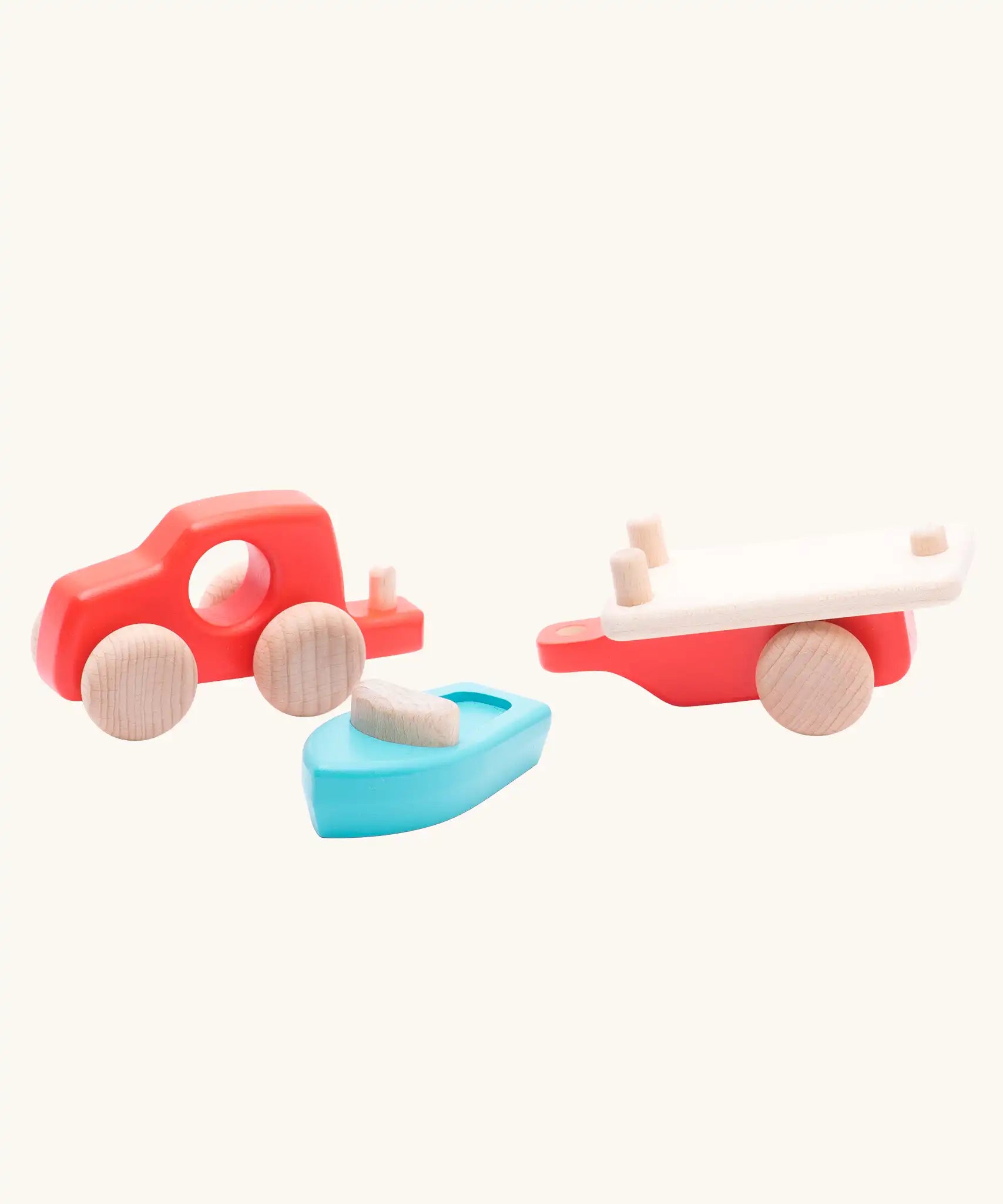 Bajo toys wooden car with boat and trailer. A coral red vehicle and trailer with a blue boat. All pieces have been taken apart.