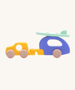 Bajo Car and Camper wooden toy. The toy comes with is a yellow car, purple camper trailer attachment and a mint green coloured surf board that sits on the roof of the camper.These heirloom quality toys are part of a wide range of Bajo wooden toys available here at Babipur.