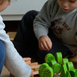 Children playing with the different trees from Bajo's forest central park set