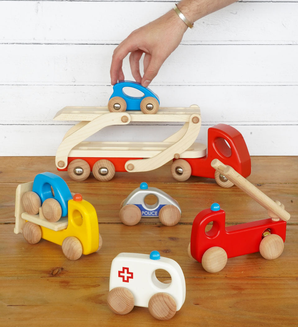 yellow and orange cars on its trailer