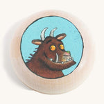 A wooden gruffalo magnet on a cream background