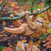 Close up of the Bajo solid wooden sloth toy figure hanging from a tree branch