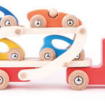 Bajo childrens wooden transporter truck on a white background carrying blue