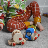 A child playing with the Bajo choo-choo train wooden pull-along toy. These heirloom quality toys by Bajo are part of a wide range of wooden toys available here at Babipur.