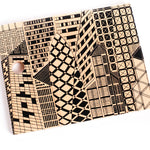 The Bajo City Puzzle is a chunky 9-piece wooden puzzle that can be used to make a striking monochrome cityscape jigsaw