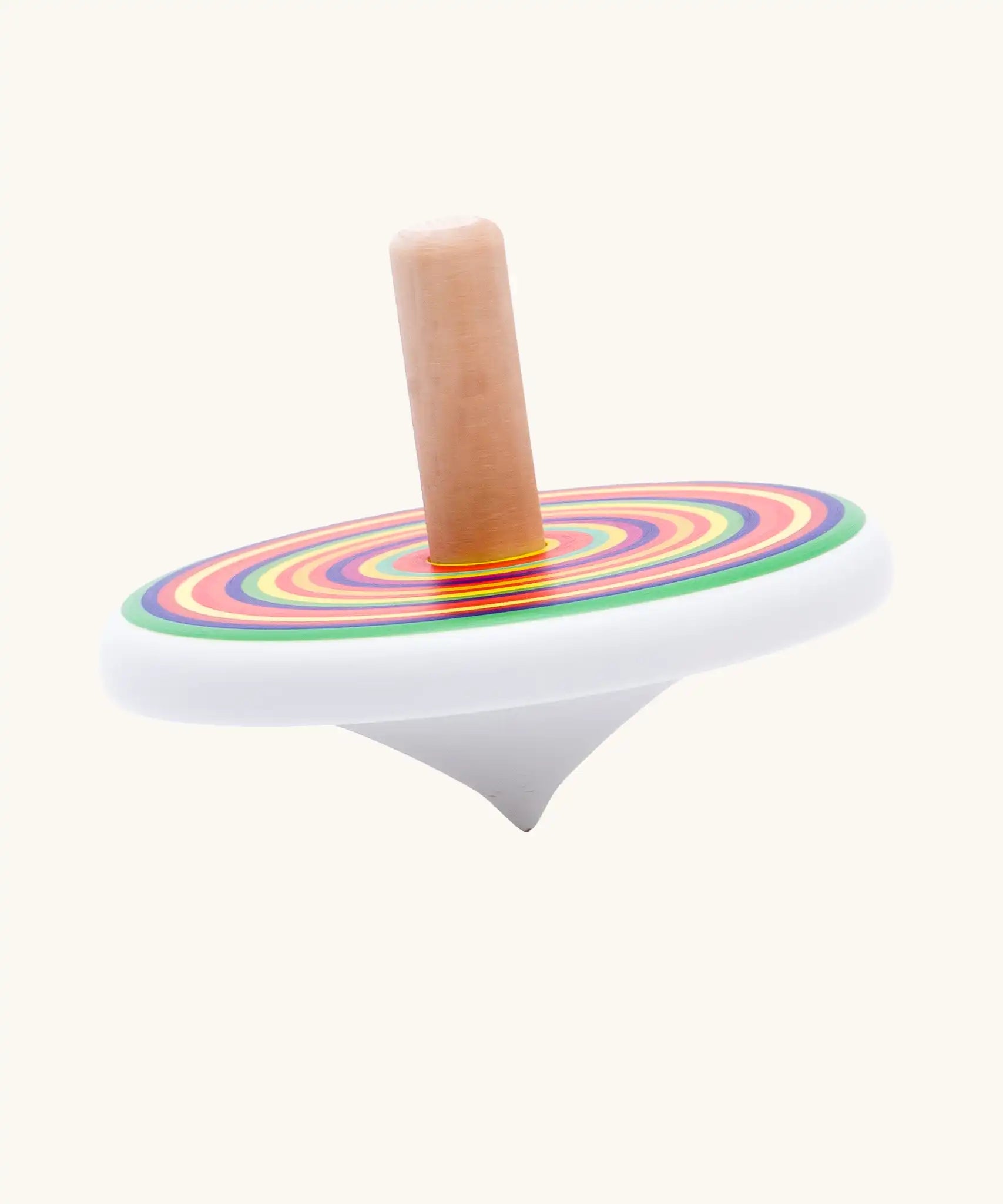 Side profile of Bajo colourful circles spinning top wooden toy. White painted wooden base with a rainbow stripe decorated top and a natural wood handle.